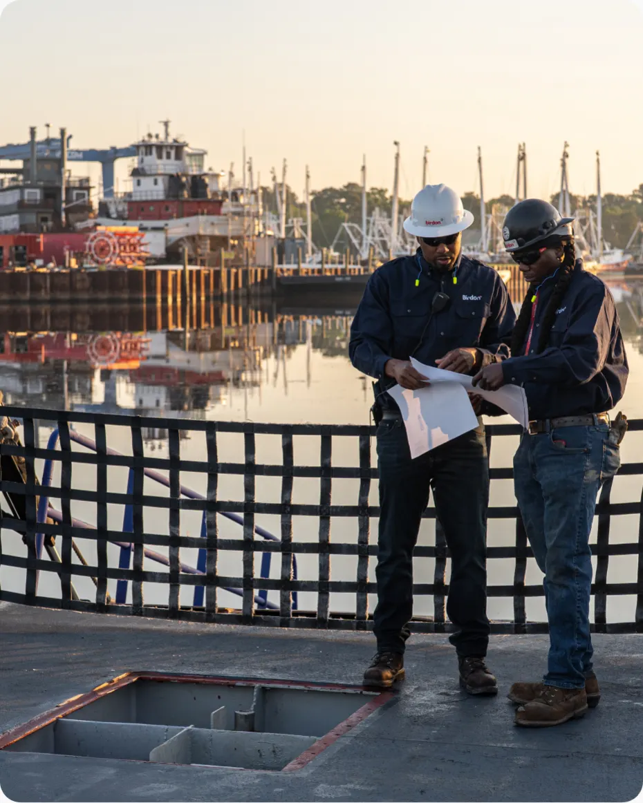 Two people talking on a dock