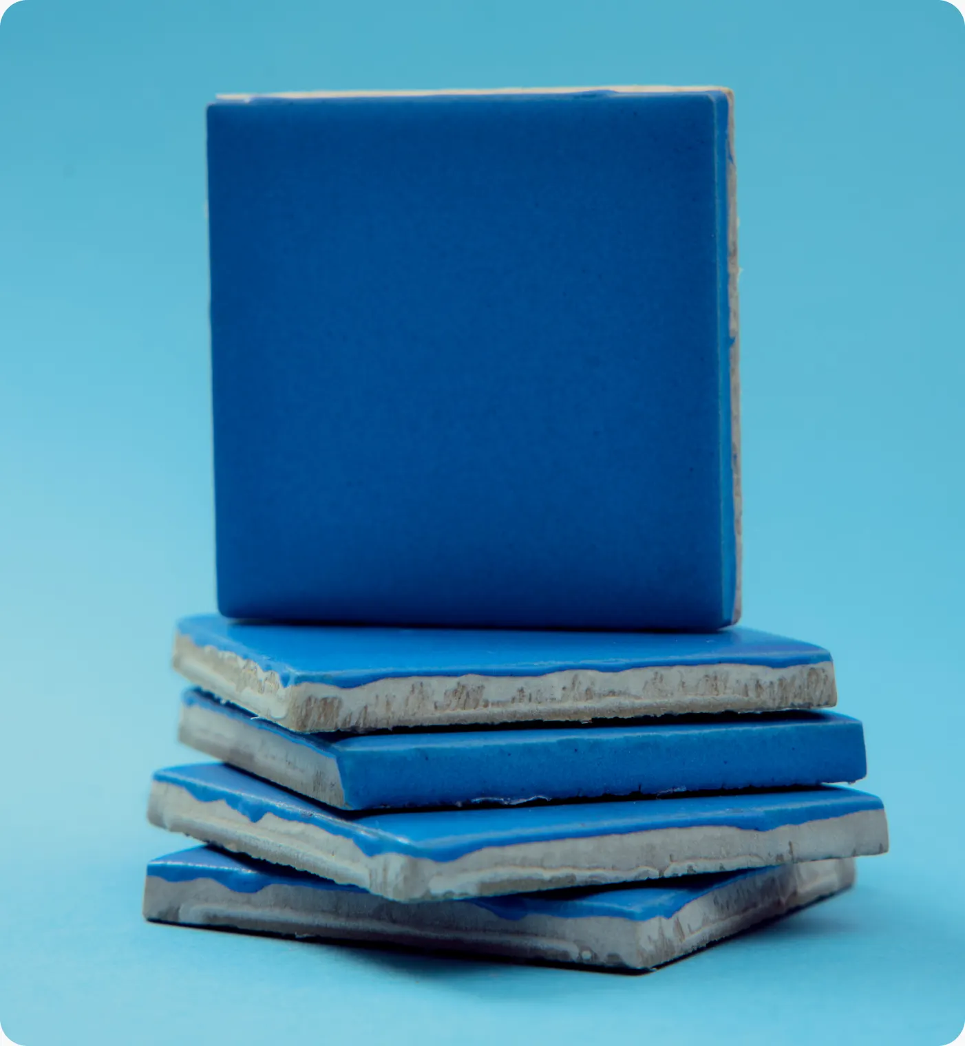 Stack of glossy blue tiles